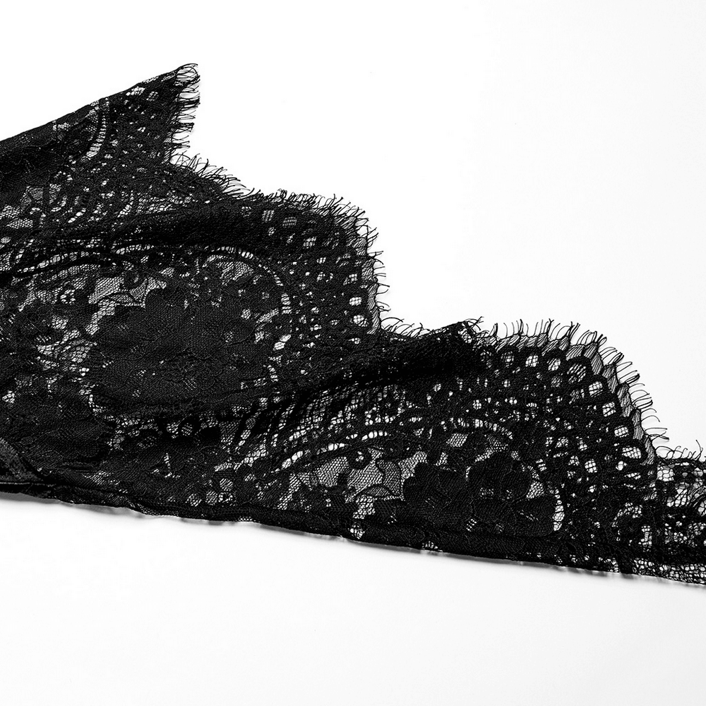 Black lace fabric detail showcasing intricate Gothic patterns perfect for elegant designs.