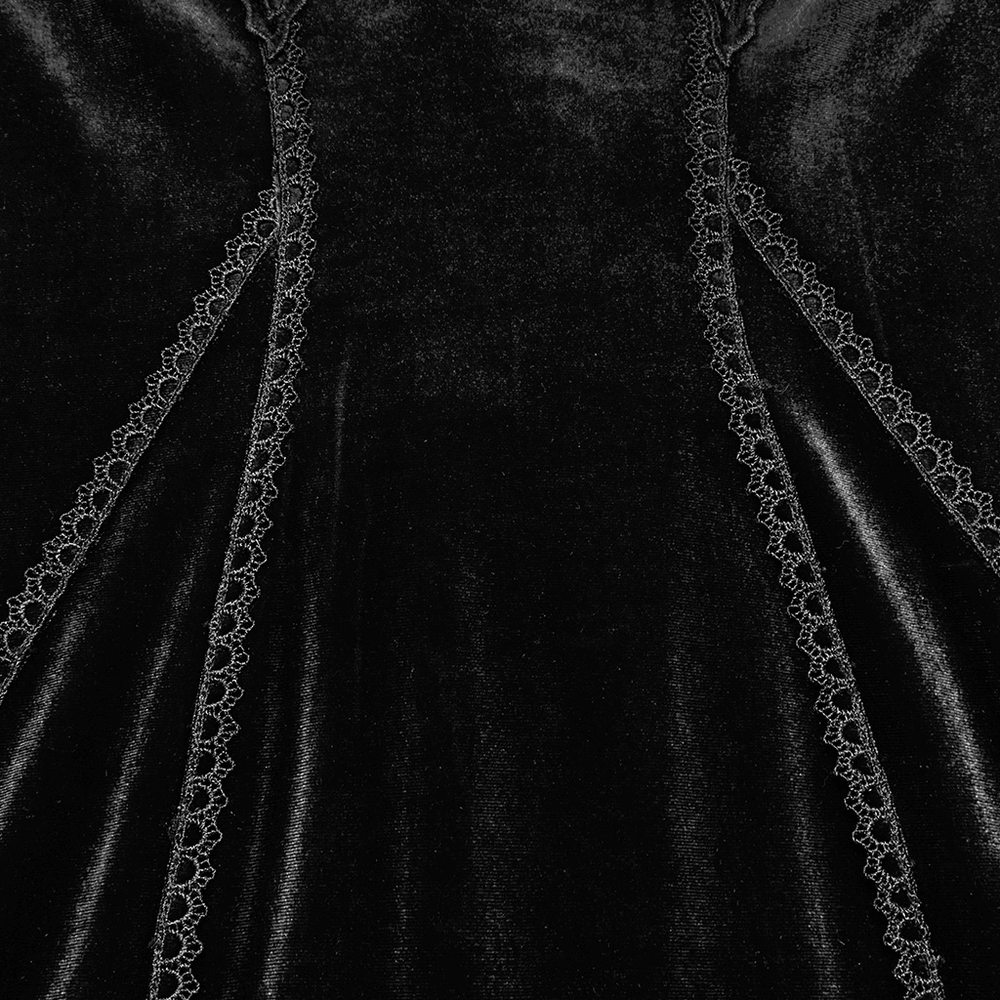 Close-up of black velvet fabric with intricate lace trim detailing, highlighting gothic elegance and design.