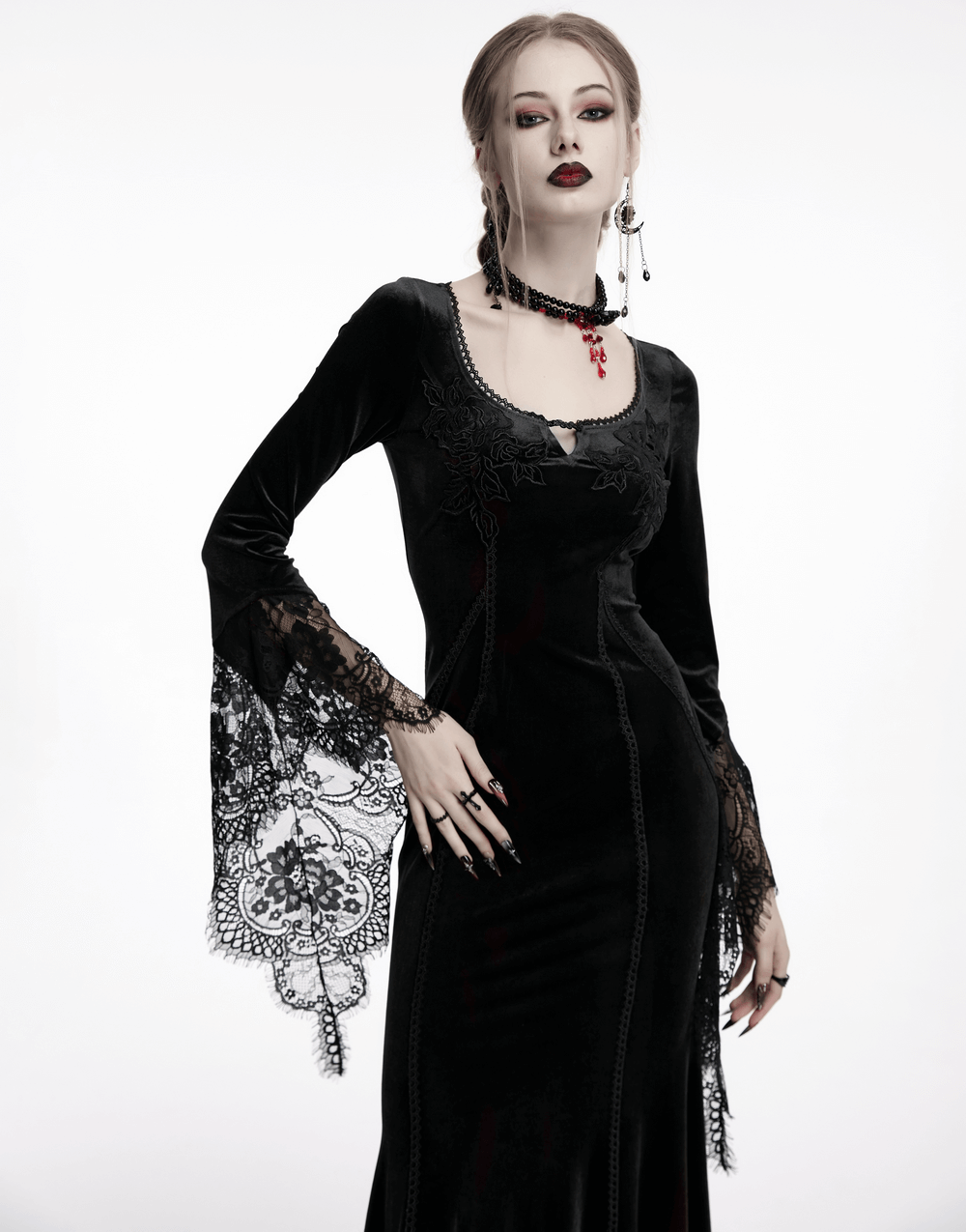 Elegant black gothic velvet maxi dress with lace sleeves and rose details, perfect for a dark, enchanting look.