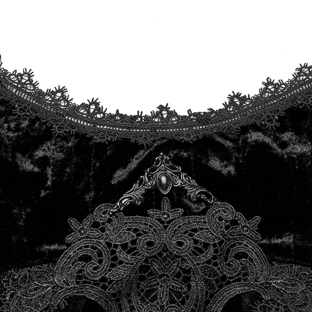 Close-up of intricate retro lace trim on black gothic velvet dress, featuring metal accents for a luxurious look.