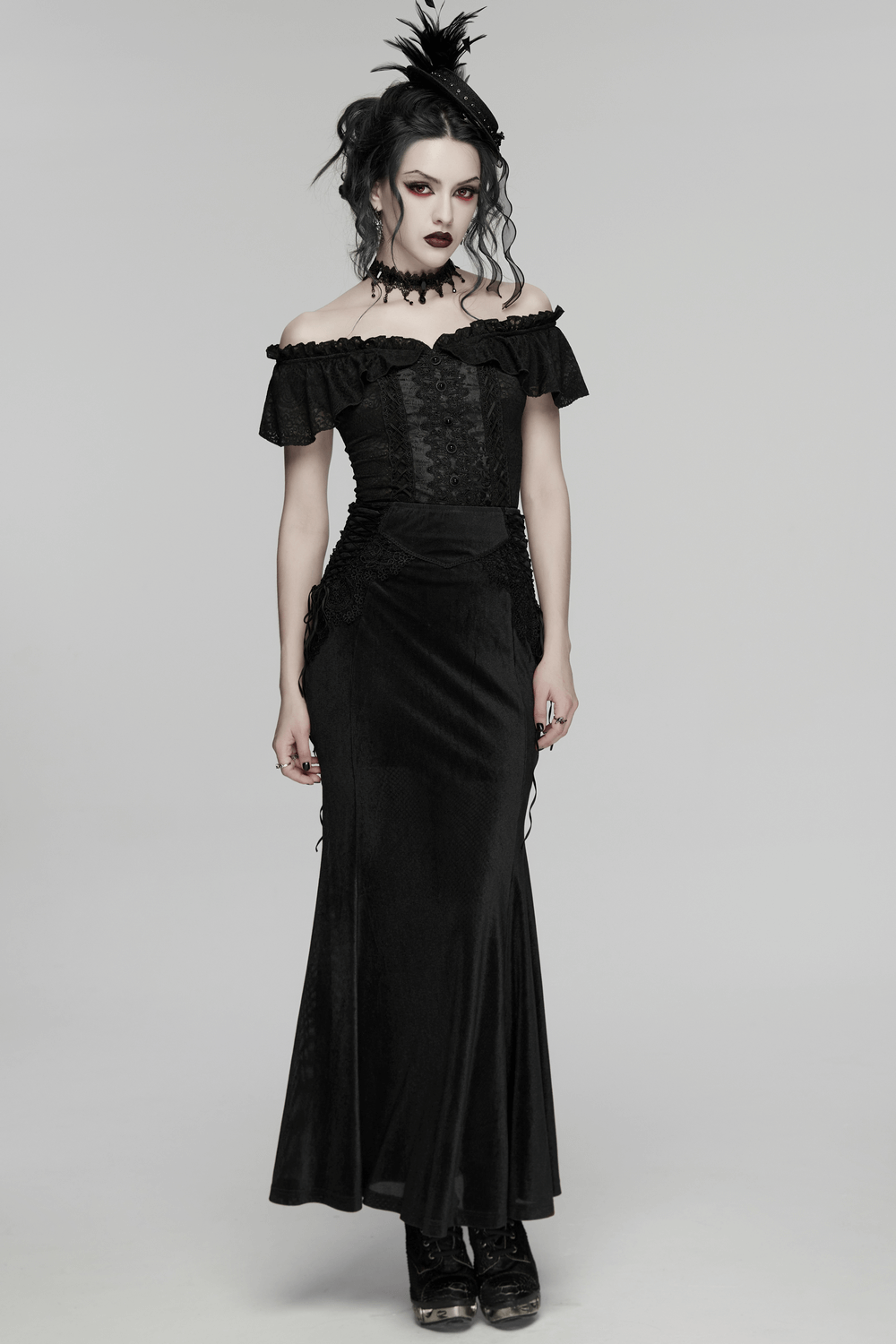 Black Gothic Velvet Mermaid Maxi Skirt with Lace modeled by a gothic woman, showcasing elegant lace and flowing hem.