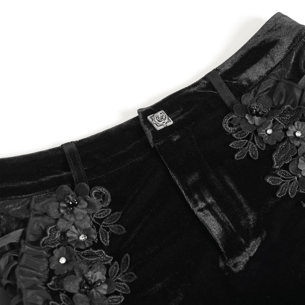 Black Gothic Velvet Shorts With Floral Ruffle Trim featuring floral applique and lace-up details.