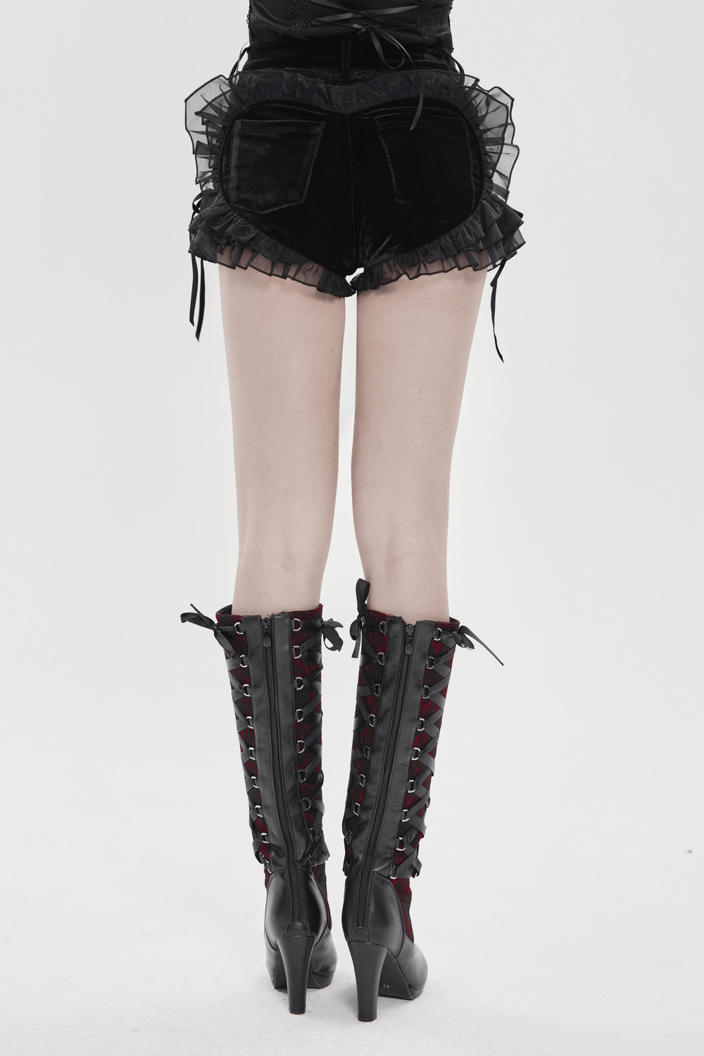 Black Gothic Velvet Shorts With Floral Ruffle Trim showcasing lace-up design and sheer ruffle detail from the back.