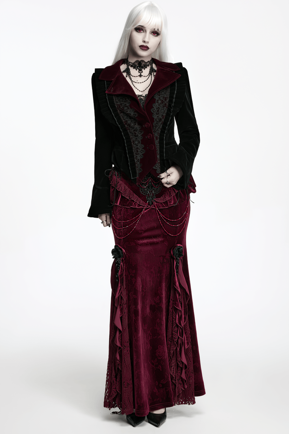 Black Gothic Velvet Tailcoat with Burgundy Lace Panels worn by a model, featuring ornate lace and flared sleeves.