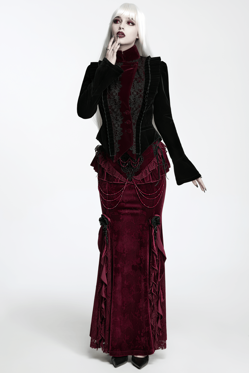 Black Gothic Velvet Tailcoat with Burgundy Lace Panels worn by a model, showcasing a stylish Victorian goth look.