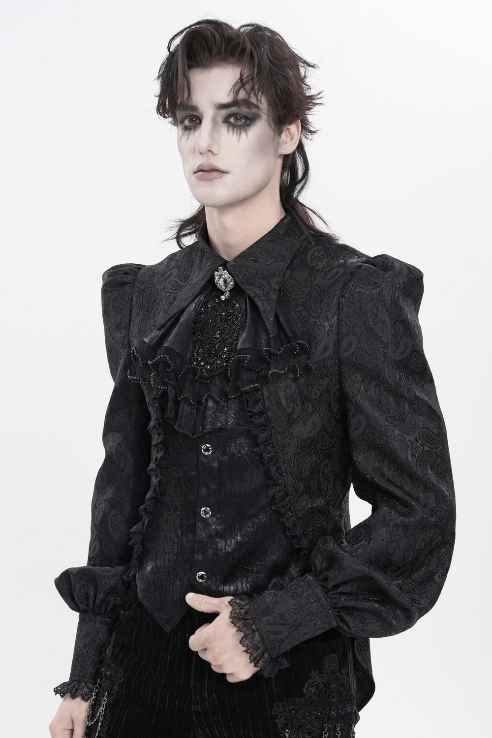 Black Gothic Victorian Jabot Collar With Brooch worn by a model in a dramatic pose and makeup.