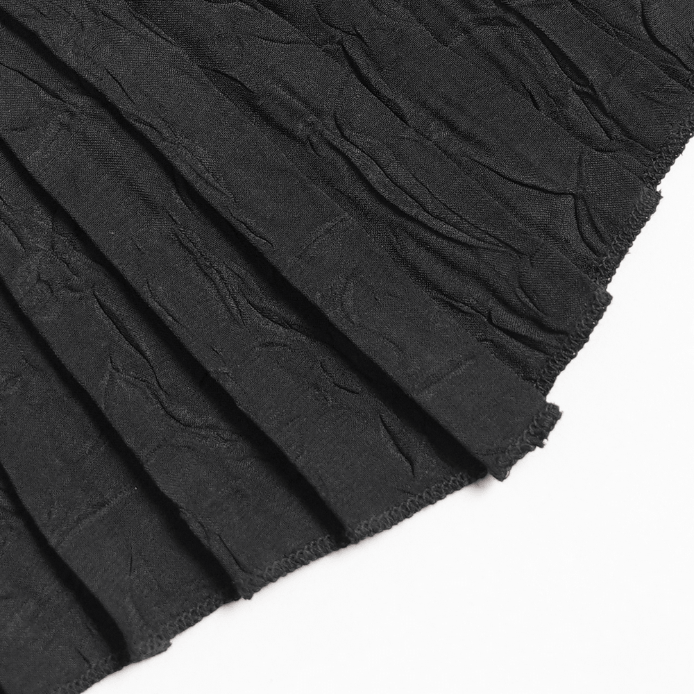 Black Gothic Victorian Jabot Collar With Brooch in elegant pleated black fabric, showcasing intricate texture and design.