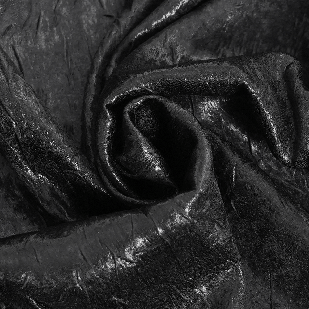 Close-up of luxurious black fabric with a rich texture, perfect for gothic or Victorian-inspired clothing.