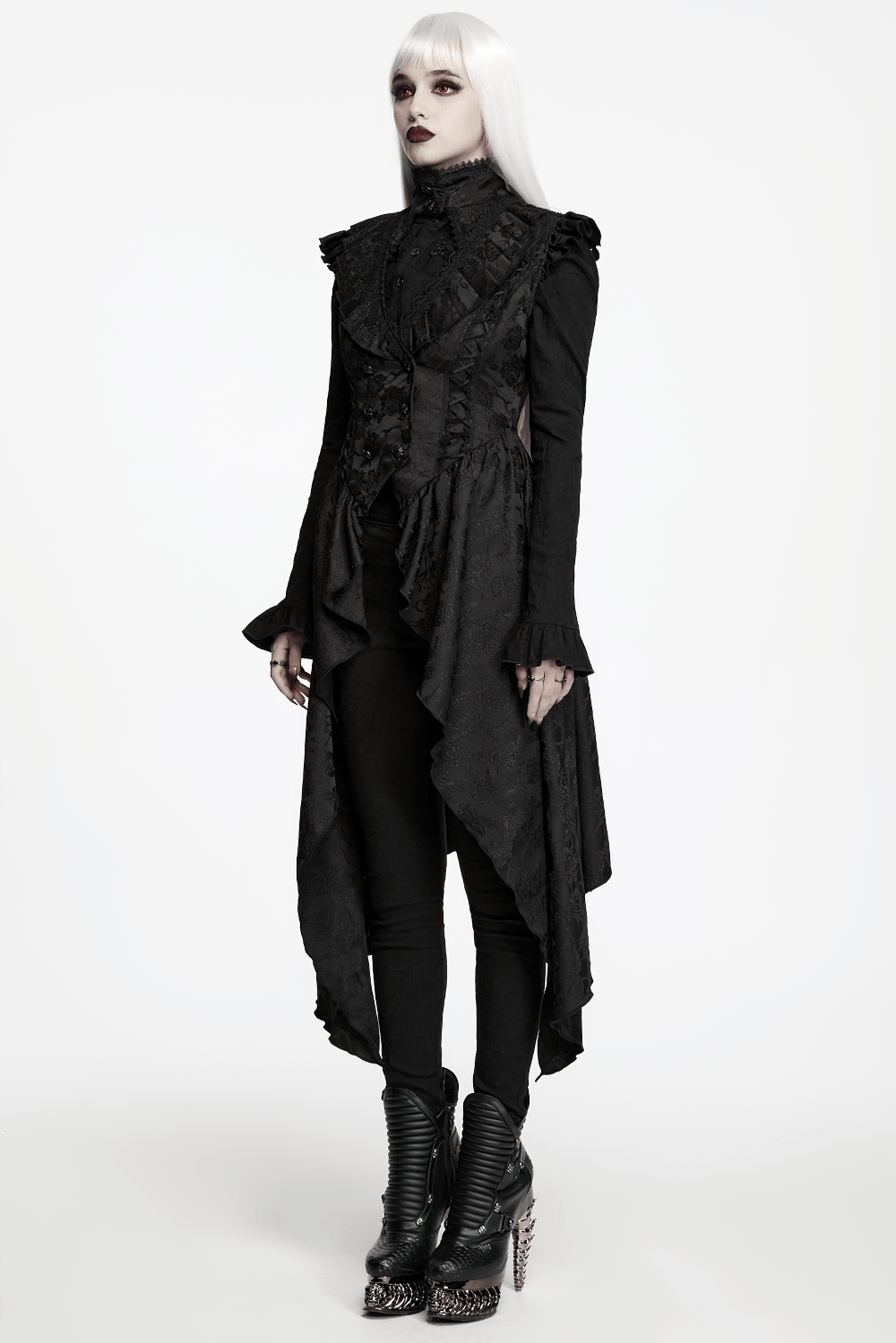 Black Gothic Victorian Tailcoat Vest with Lace Ruffles modeled by a model with white hair and stylish boots.