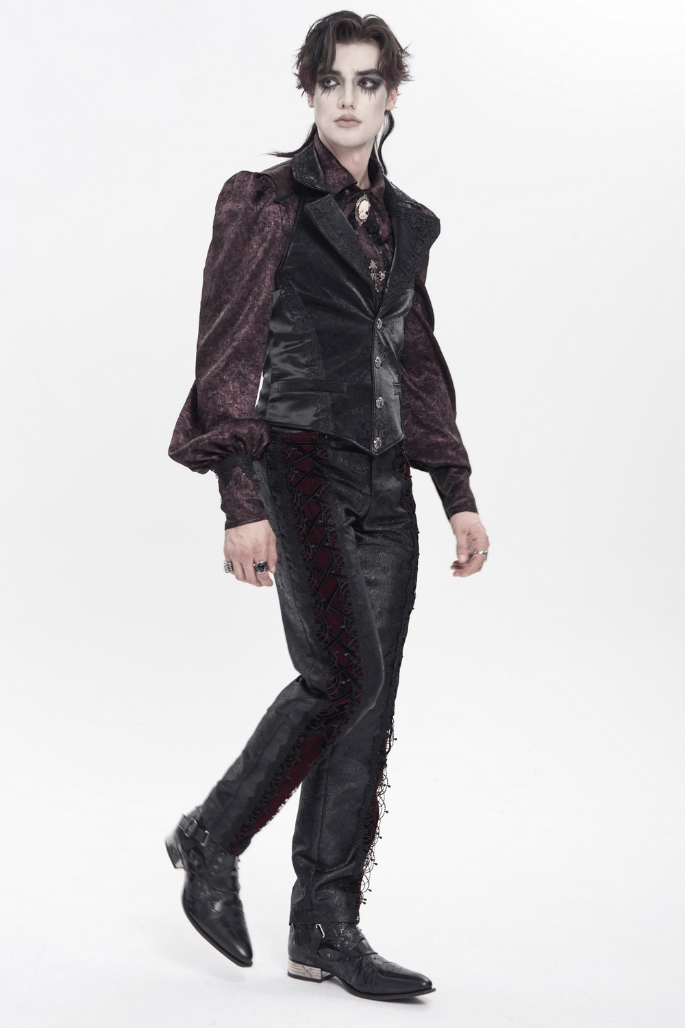 Black Gothic Waistcoat With Lace Lapel and Buttons worn over a ruffled shirt and paired with stylish pants.