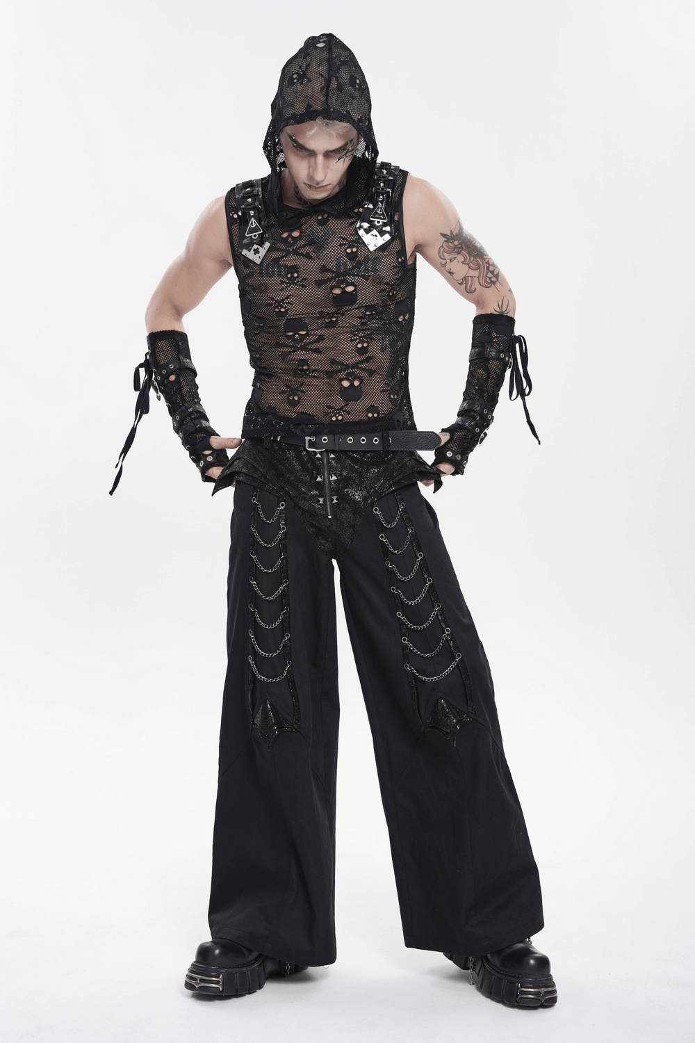 Black Gothic Wide Leg Pants with Chains and Studs styled with a sheer top and accessories in a cyberpunk aesthetic.
