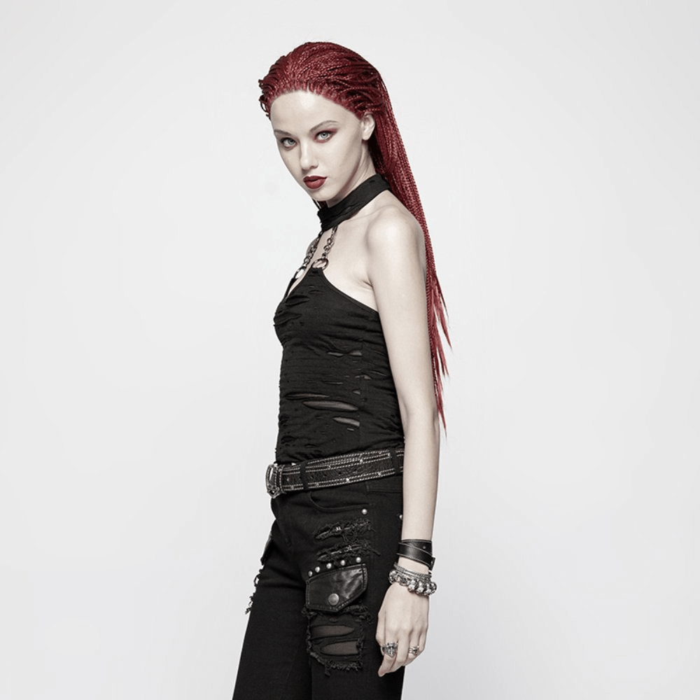 Model in a black halter crop camisole with chain neck detail, showcasing punk style against a minimalist background.