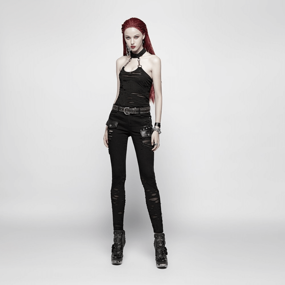 Edgy black halter crop camisole with chain neck detail, paired with ripped black pants for a punk rock look.