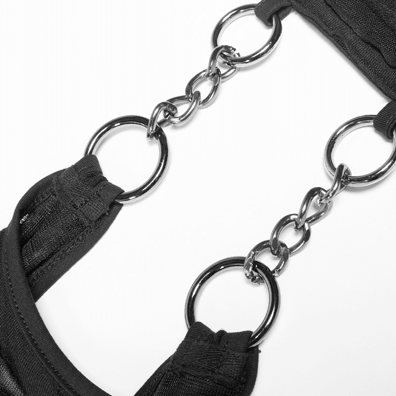 Close-up of black halter top chains, showcasing stylish metal ring detail for a punk rock fashion statement.