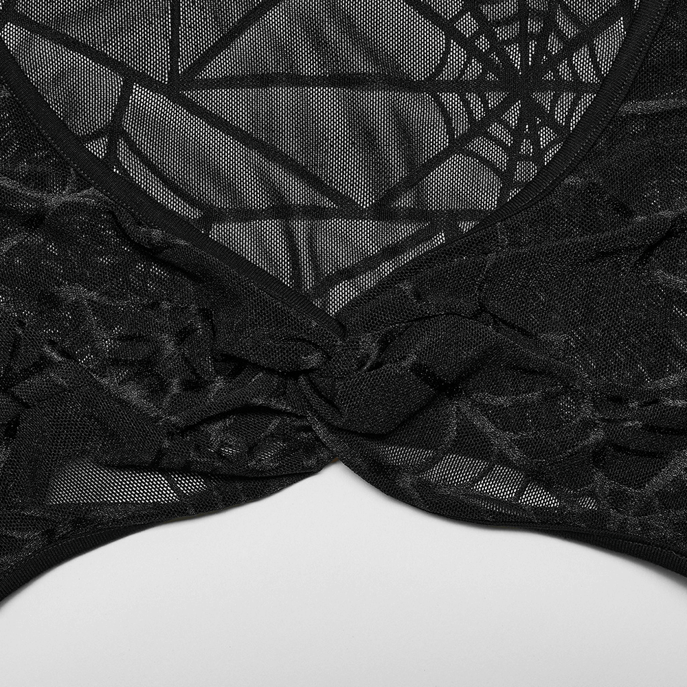Close-up of black halter neck top with spiderweb design and trendy front twist detail.