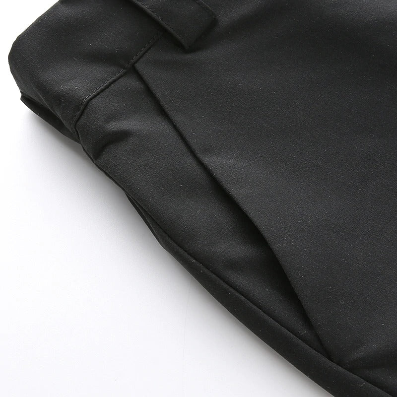 Close-up of black high waist cargo pants showcasing sleek fabric and stylish design for trendy women's street style.