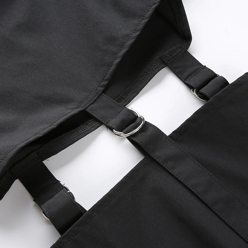 Close-up of black high waist cargo pants featuring stylish buckle details and straps for a trendy street style look.