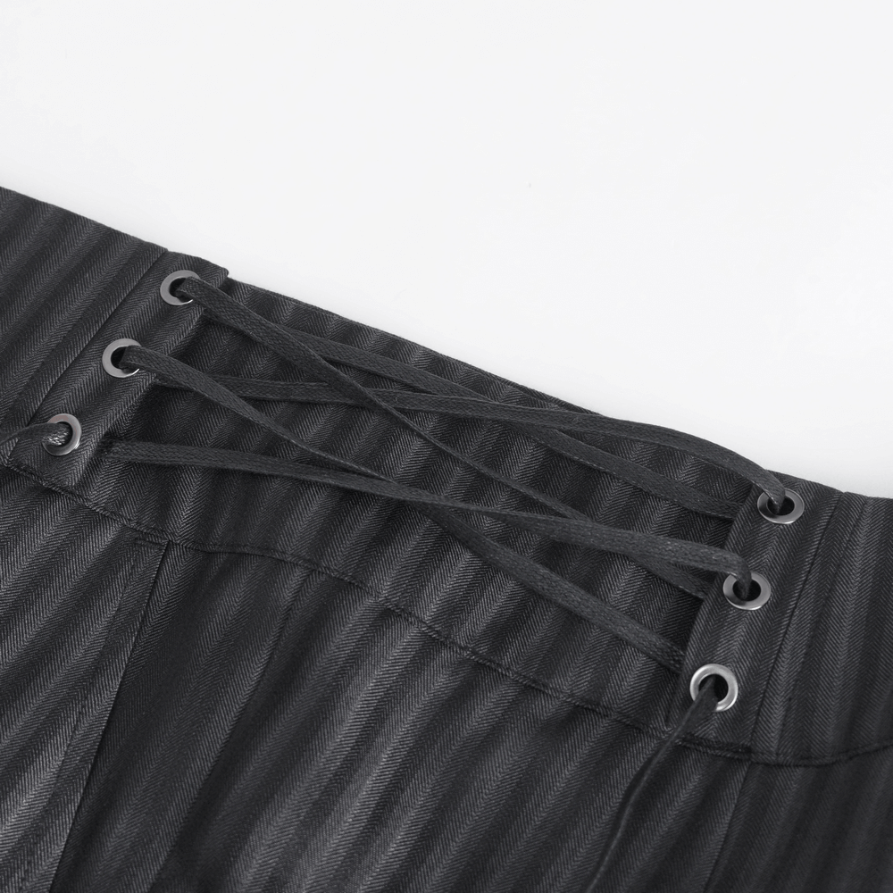 Close-up of lace-up side detail on black high-waisted striped trousers for men.