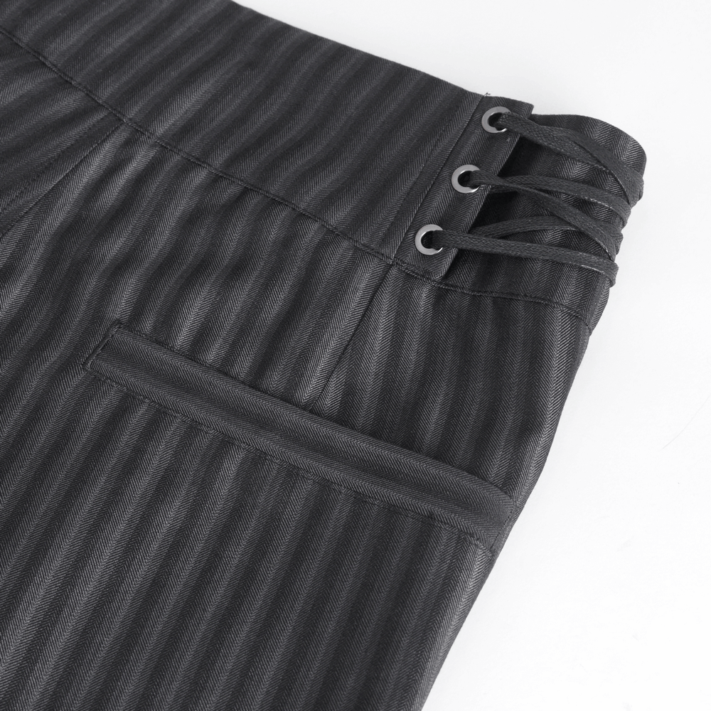 Close-up of black high-waisted striped trousers with lace-up detail on the side, perfect for stylish men's fashion.