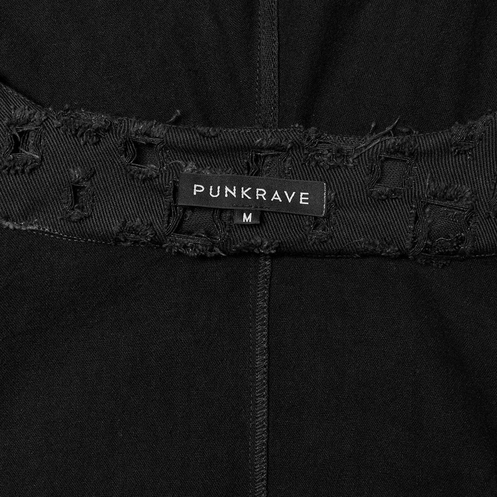 Close-up of the PUNKRAVE label on a black garment, featuring distressed details and a size indication of M.