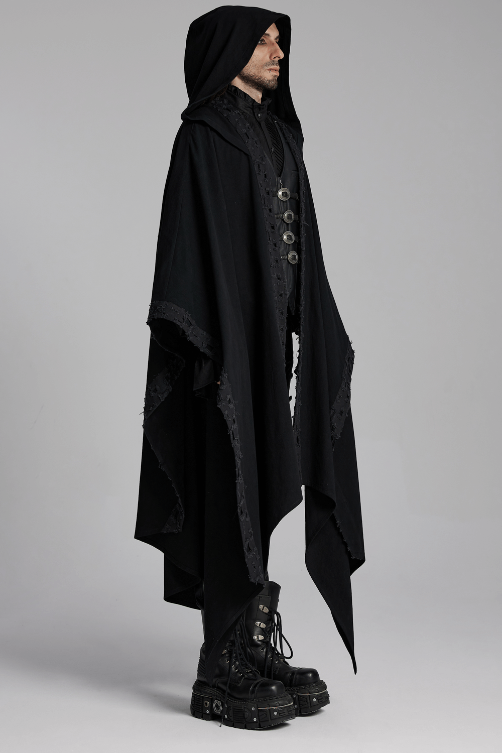 Black hooded cloak with gothic lace trim and pointed hem, styled with high-heeled boots for a dark, mystical look.