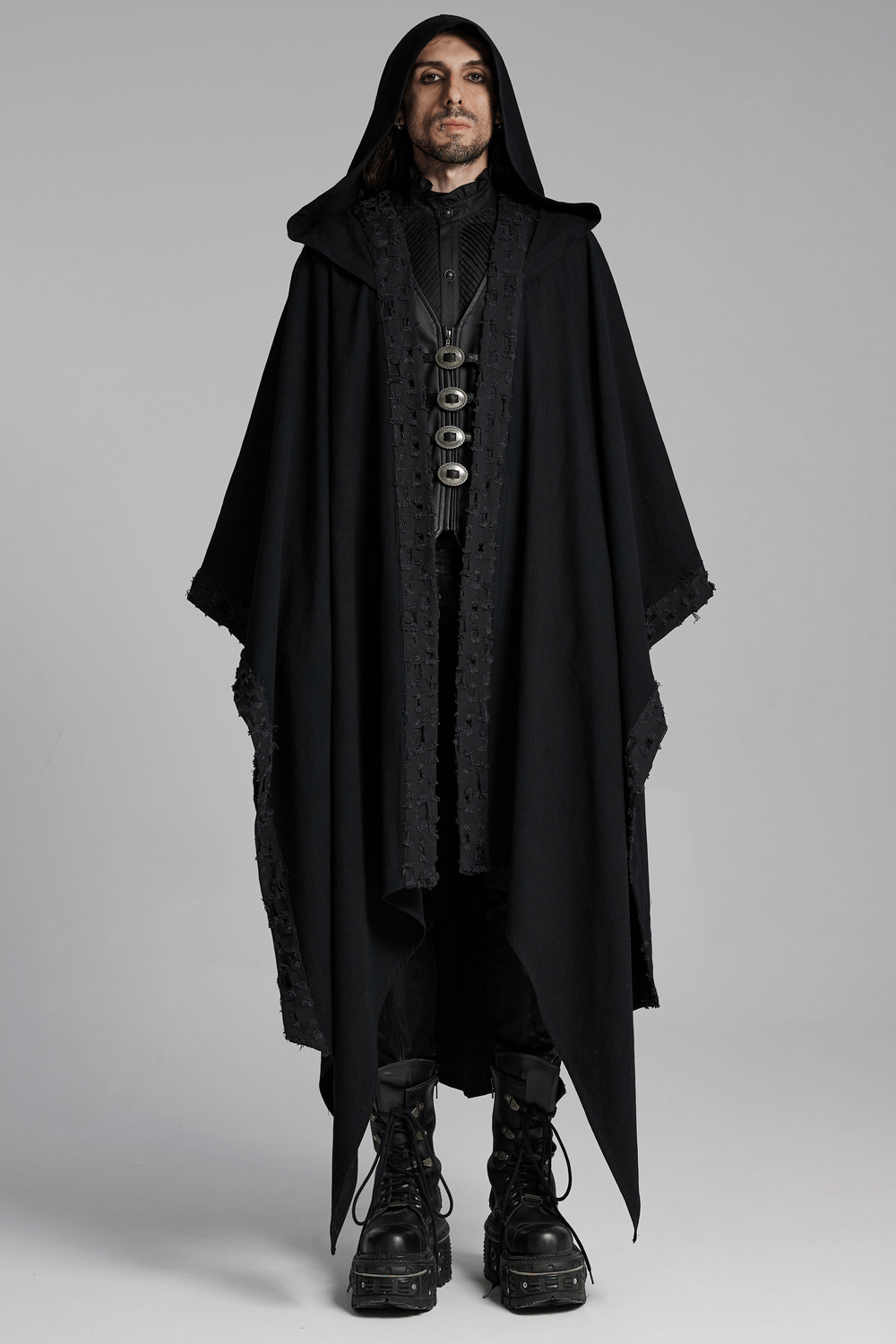 Black hooded cloak with gothic lace trim, worn by a model, exuding a dark and mystical vibe. Perfect for a gothic wardrobe.