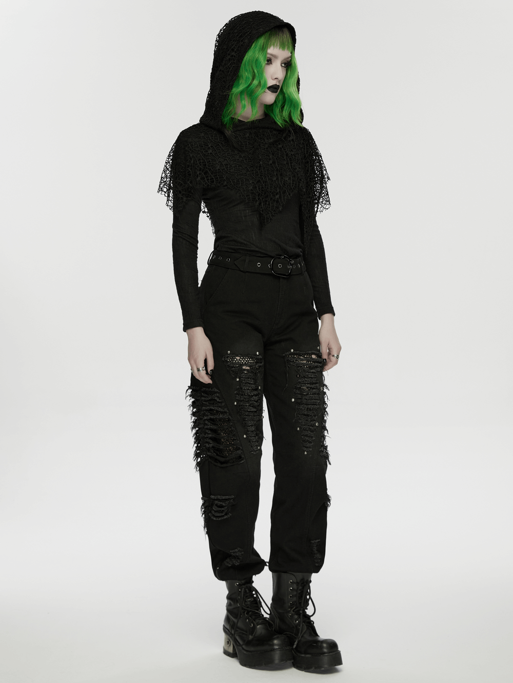 Black Hooded Mesh Overlay Wasteland Punk Top worn by model with green hair and edgy pants in a minimalist setting.