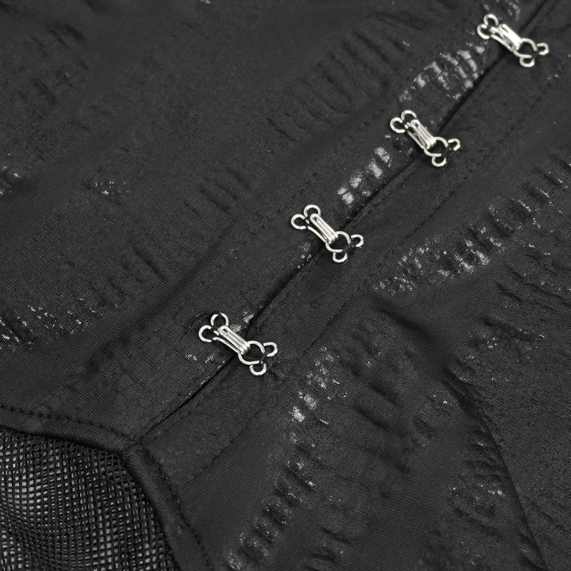 Close-up of black dress detailing with decorative silver clasps, showcasing alternative chic fashion.