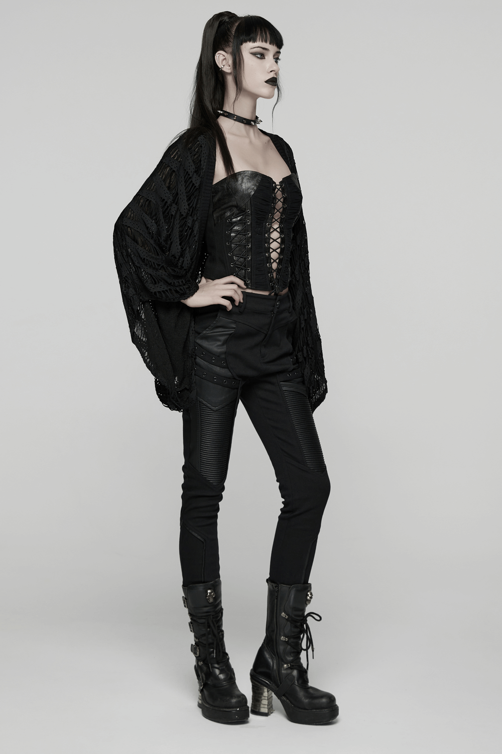 Model showcasing a Black Knit Punk Cardigan with Ragged Loose Sleeve Design in a stylish outfit.