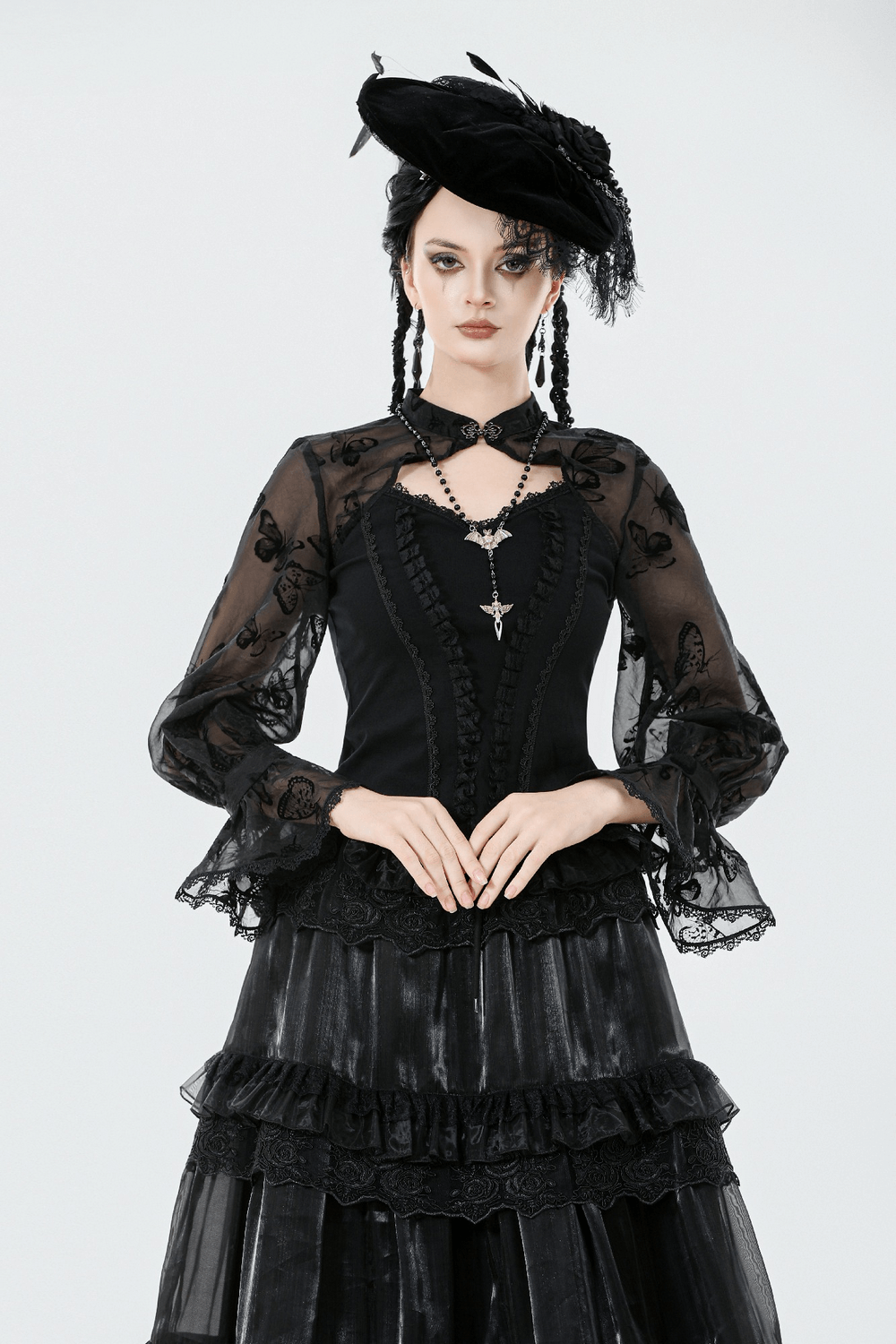 Model wearing a Black Lace and Velvet Butterfly-Detail Victorian Top with stylish accessories.