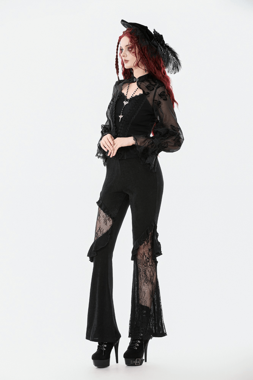 Black Lace and Velvet Butterfly-Detail Victorian Top worn with lace detail pants and a stylish hat.