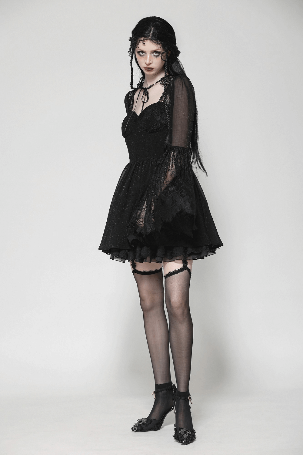 Gothic black lace bell-sleeved dress with corset back, sheer mesh, and flared romantic sleeves for modern darkwear style.