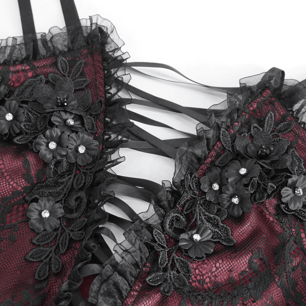 Elegant black lace top with floral embellishments and dramatic ruffle details, perfect for gothic fashion.