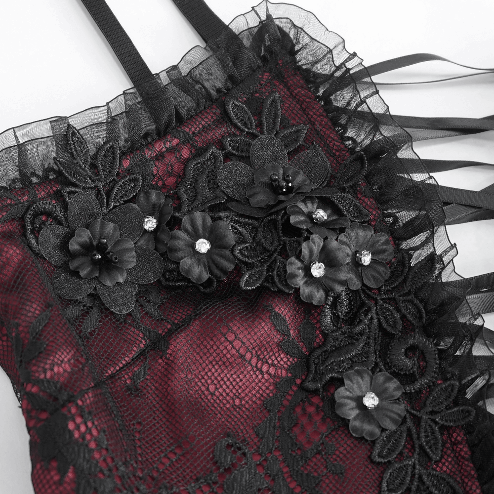 Close-up of a black lace top adorned with floral details and dramatic bell sleeves, perfect for gothic Victorian style.