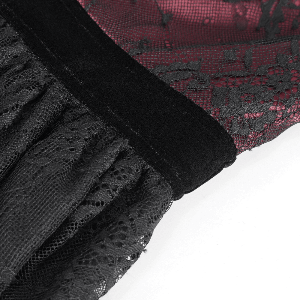Black lace fabric detail showcasing dramatic bell sleeves of a gothic Victorian style top.