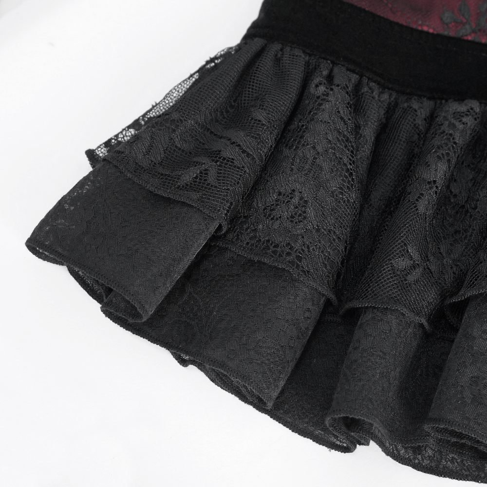 Close-up of a black lace skirt with dramatic ruffles and intricate lace detailing, perfect for gothic Victorian style outfits.