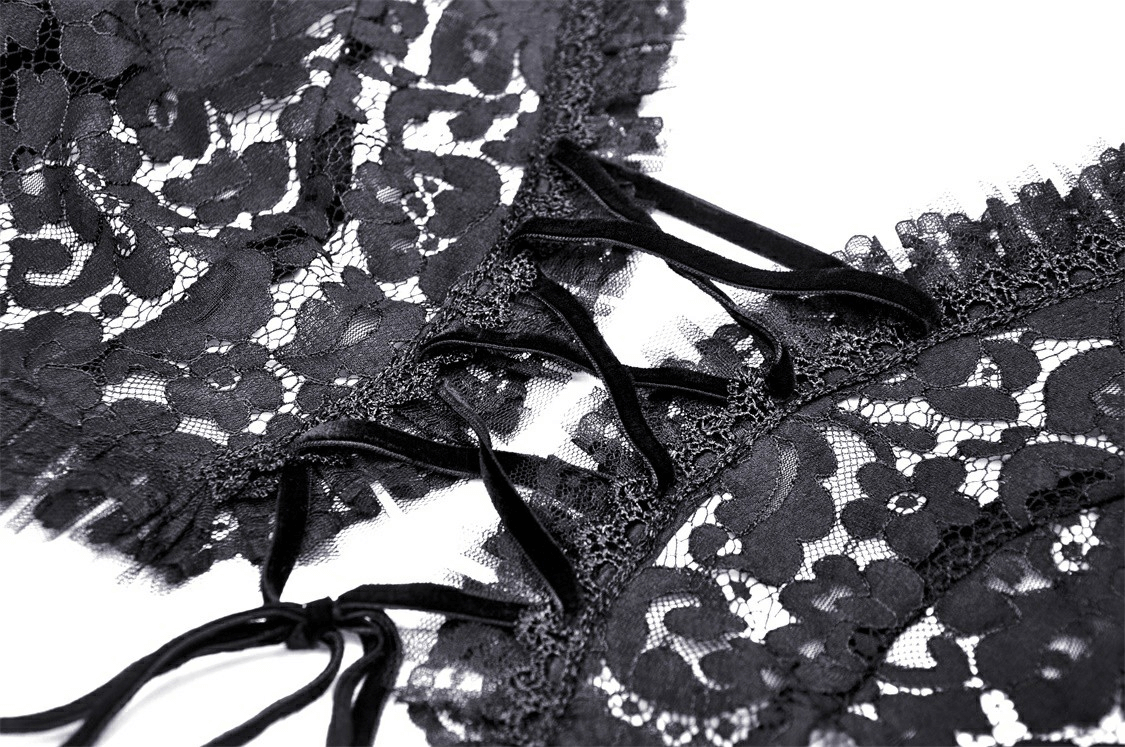 Close-up of black lace detailing and ties on gothic bolero shrug top, showcasing elegant bell sleeve design.
