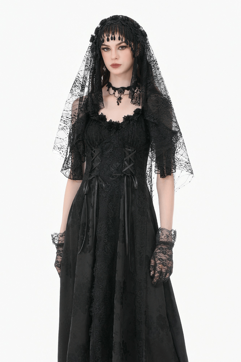 Black Lace Bridal Veil with Beaded Fringe Headpiece elegantly worn by a model in a stunning black gown.