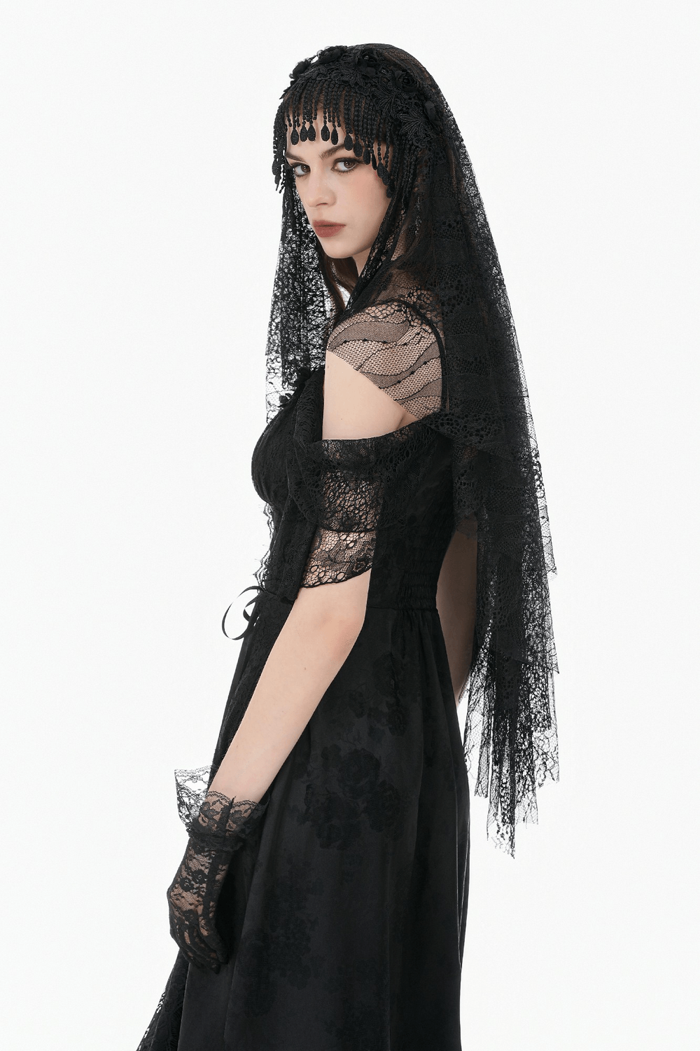 Black Lace Bridal Veil with Beaded Fringe Headpiece worn by a model in a stunning black dress.
