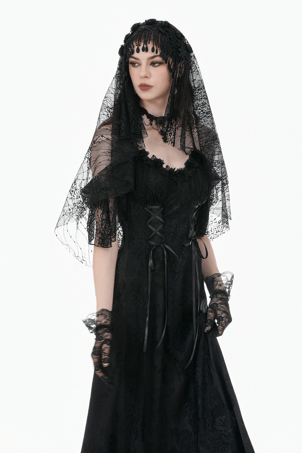 Black Lace Bridal Veil with Beaded Fringe Headpiece worn by a model in an elegant black dress.