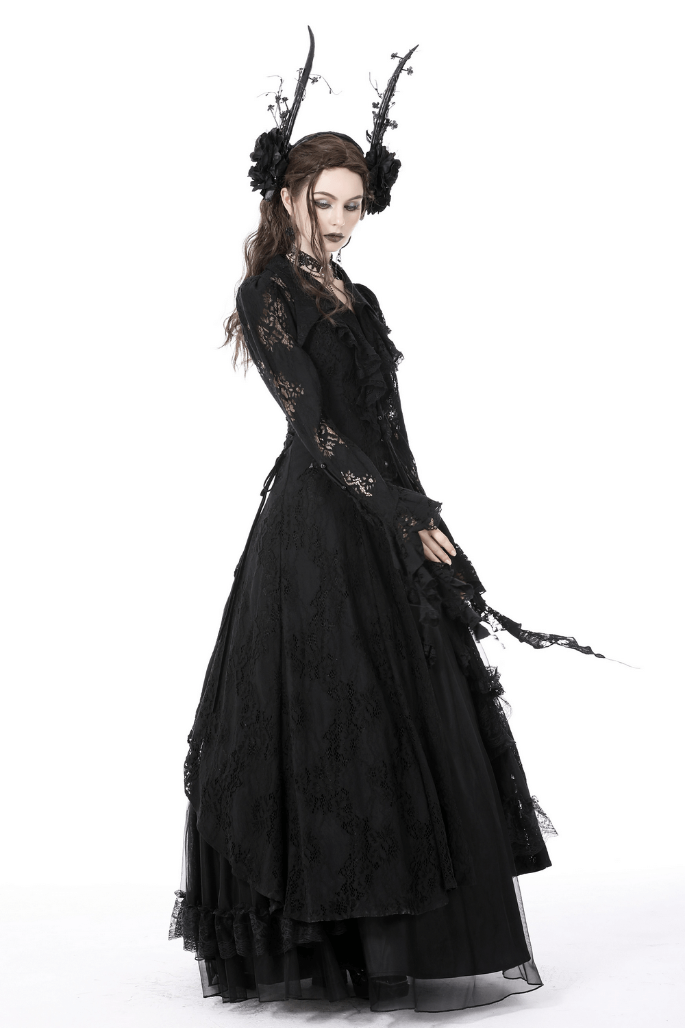 Gothic black lace dress with ruffled details and dramatic accessories for a hauntingly elegant look.