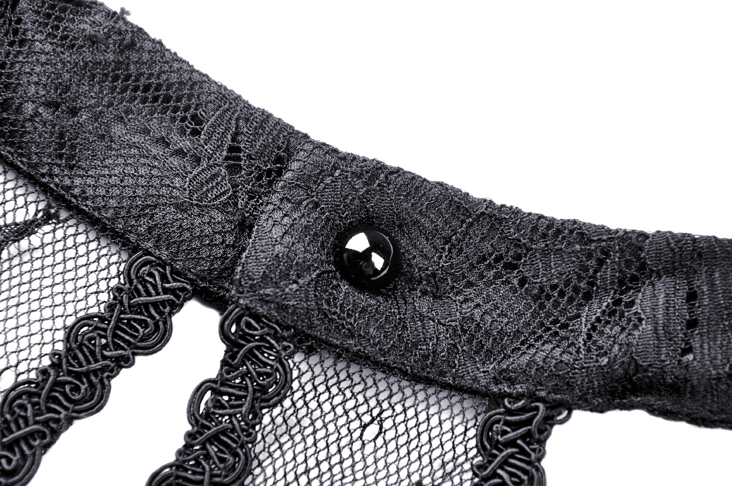 Close-up of black lace choker with button detail, ideal for gothic and alternative fashion styles.