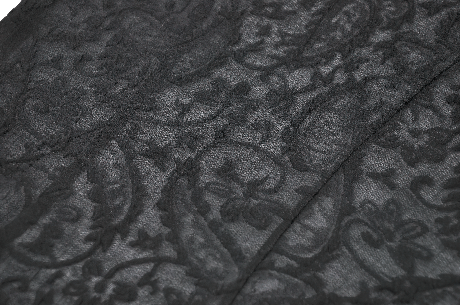 Black Lace Corset Top with Frilled Hem and Button Detail fabric close-up showcasing intricate floral lace design.