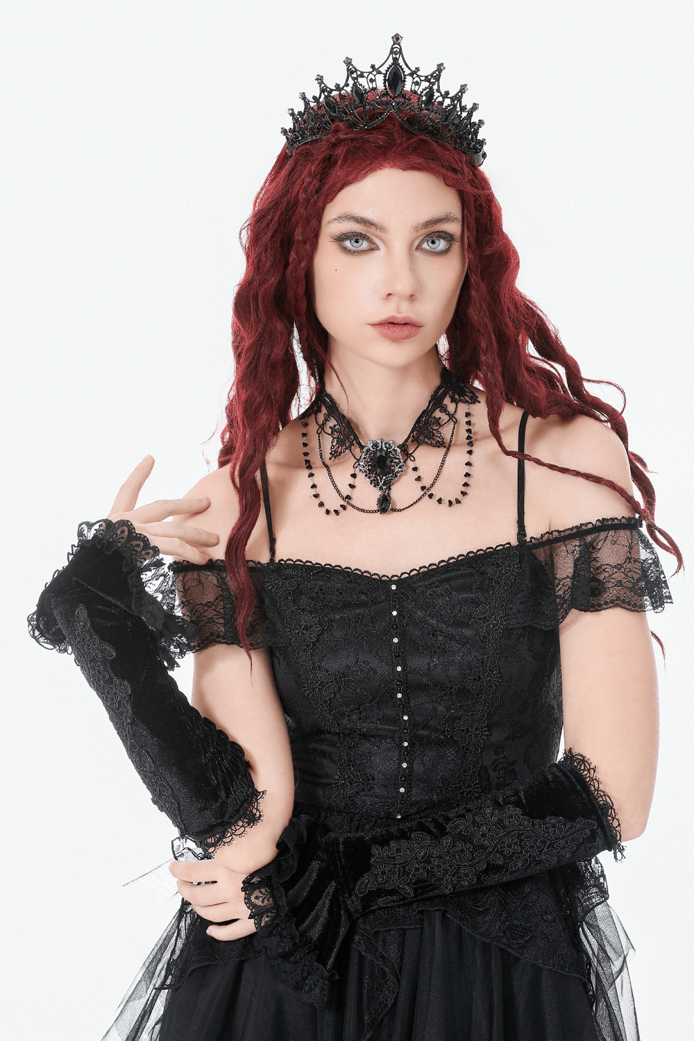 Black Lace Gothic Arm Warmers with Ruffles and Floral Design worn by a model in a gothic outfit.