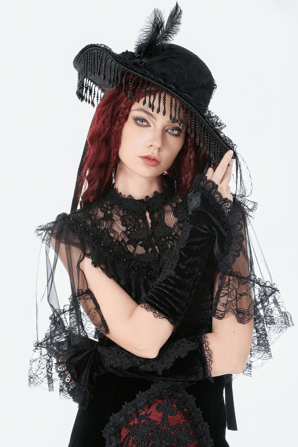 Black Lace Gothic Arm Warmers with Ruffles and Floral Design worn by a model in stylish gothic attire.