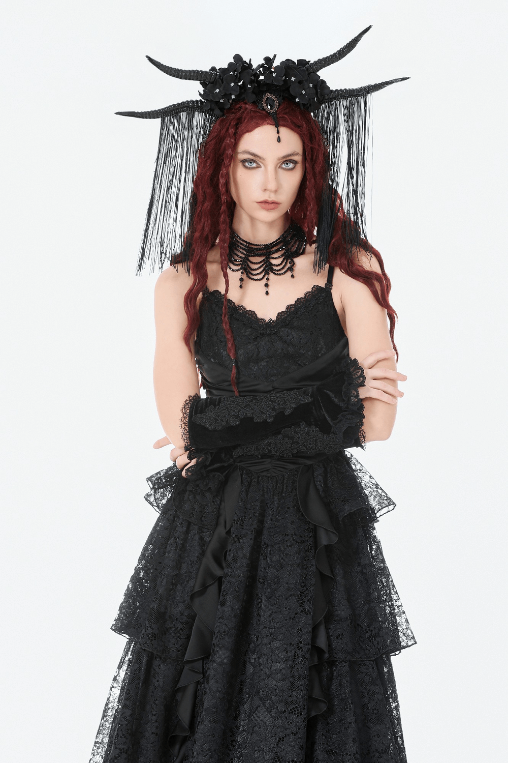 Black Lace Gothic Arm Warmers with Ruffles and Floral Design worn by a model in a dramatic gothic outfit.