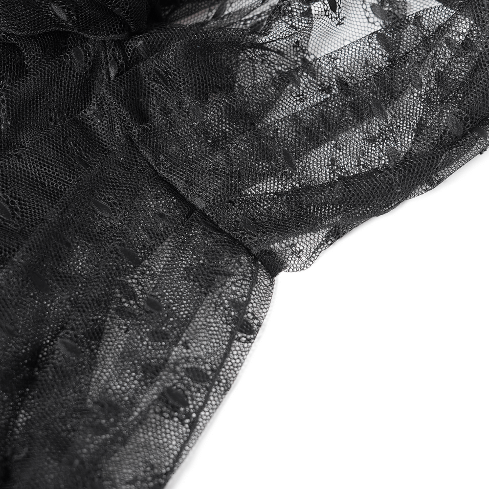 Close-up of elegant black lace fabric showcasing intricate detailing and floral lace pattern.