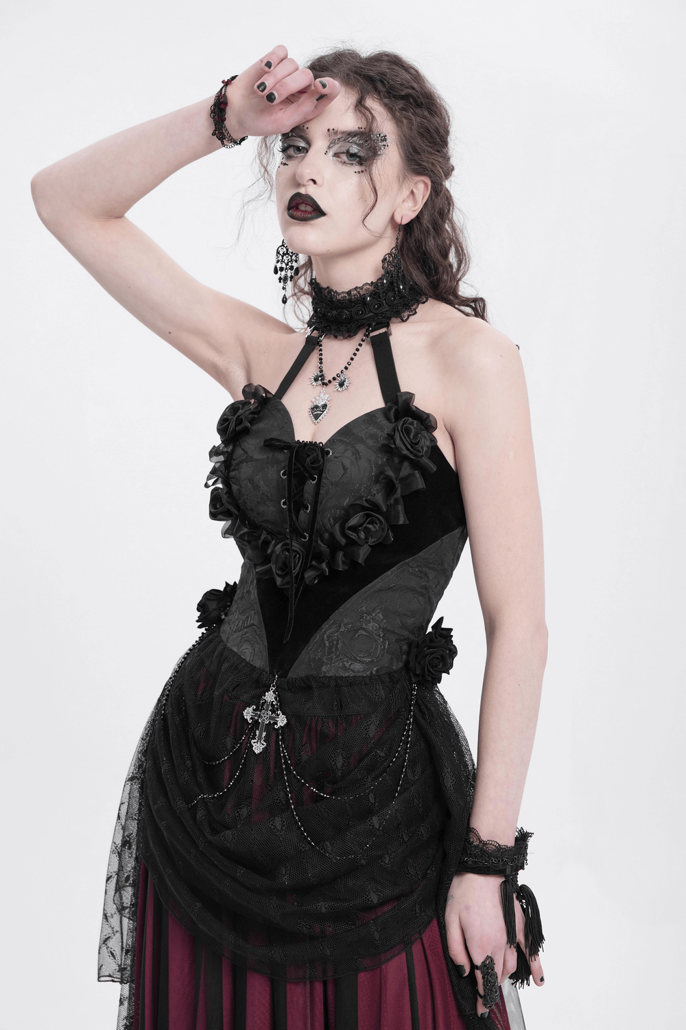 Gothic black lace halterneck top with roses and chains, featuring elegant lace detailing and dramatic layers.