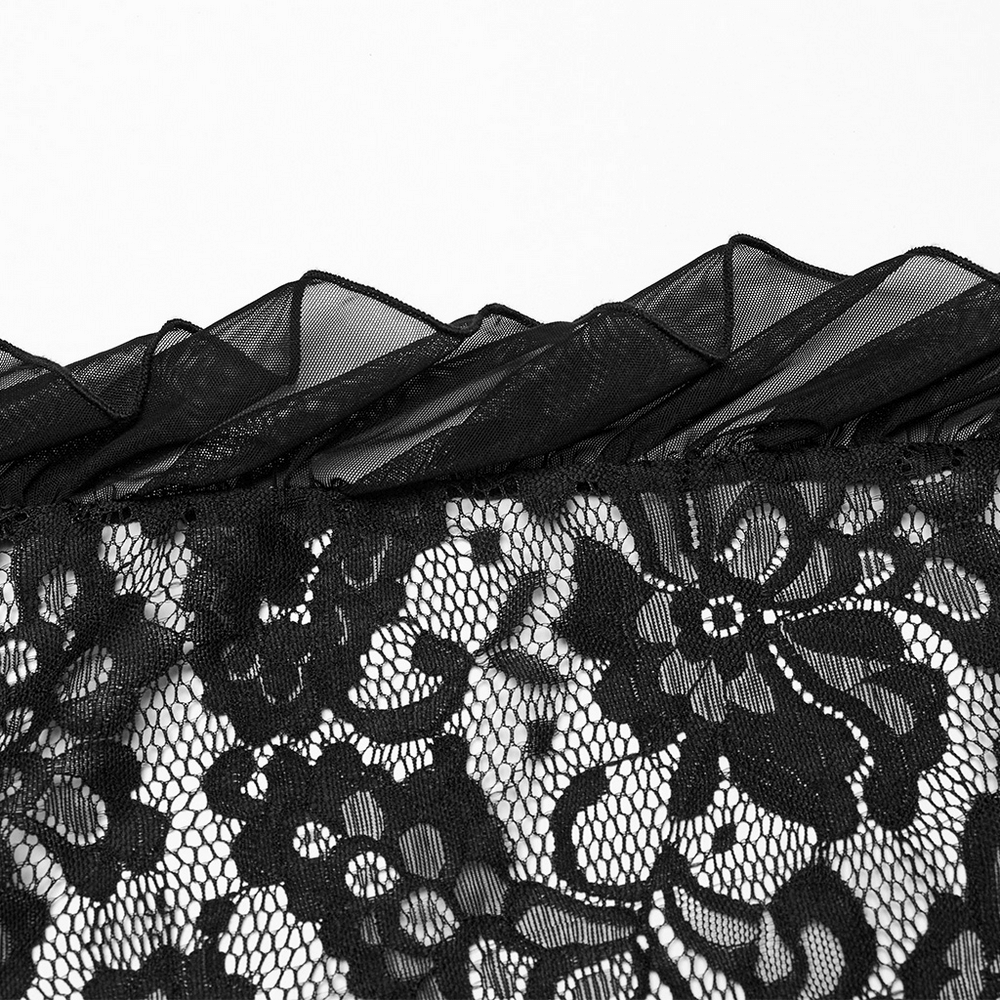 Close-up of elegant black lace with floral patterns, showcasing delicate stitching for a gothic maxi dress.