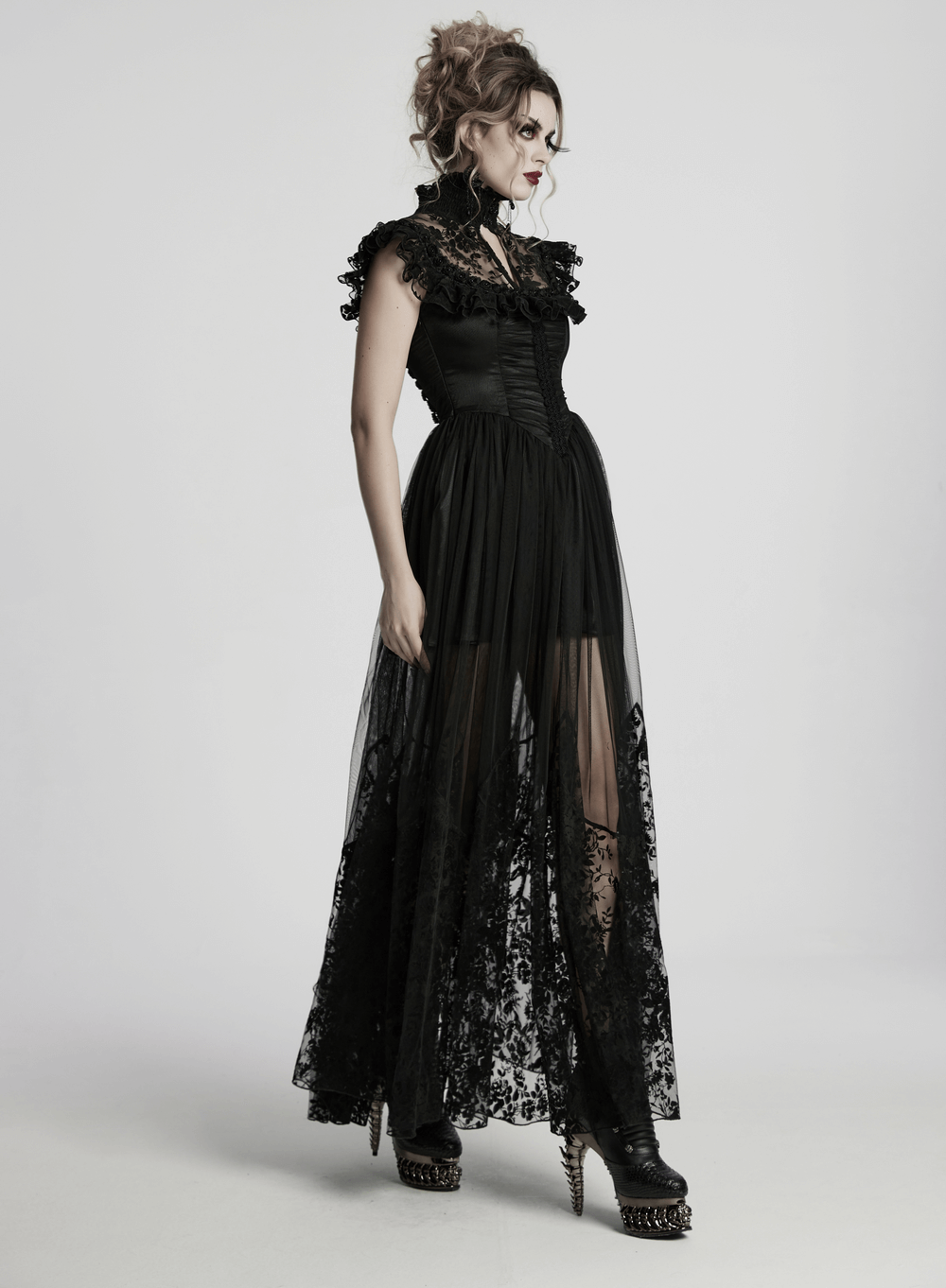Black lace gothic dress with ruffle sleeves and sheer floral overlay, perfect for dramatic gothic occasions.